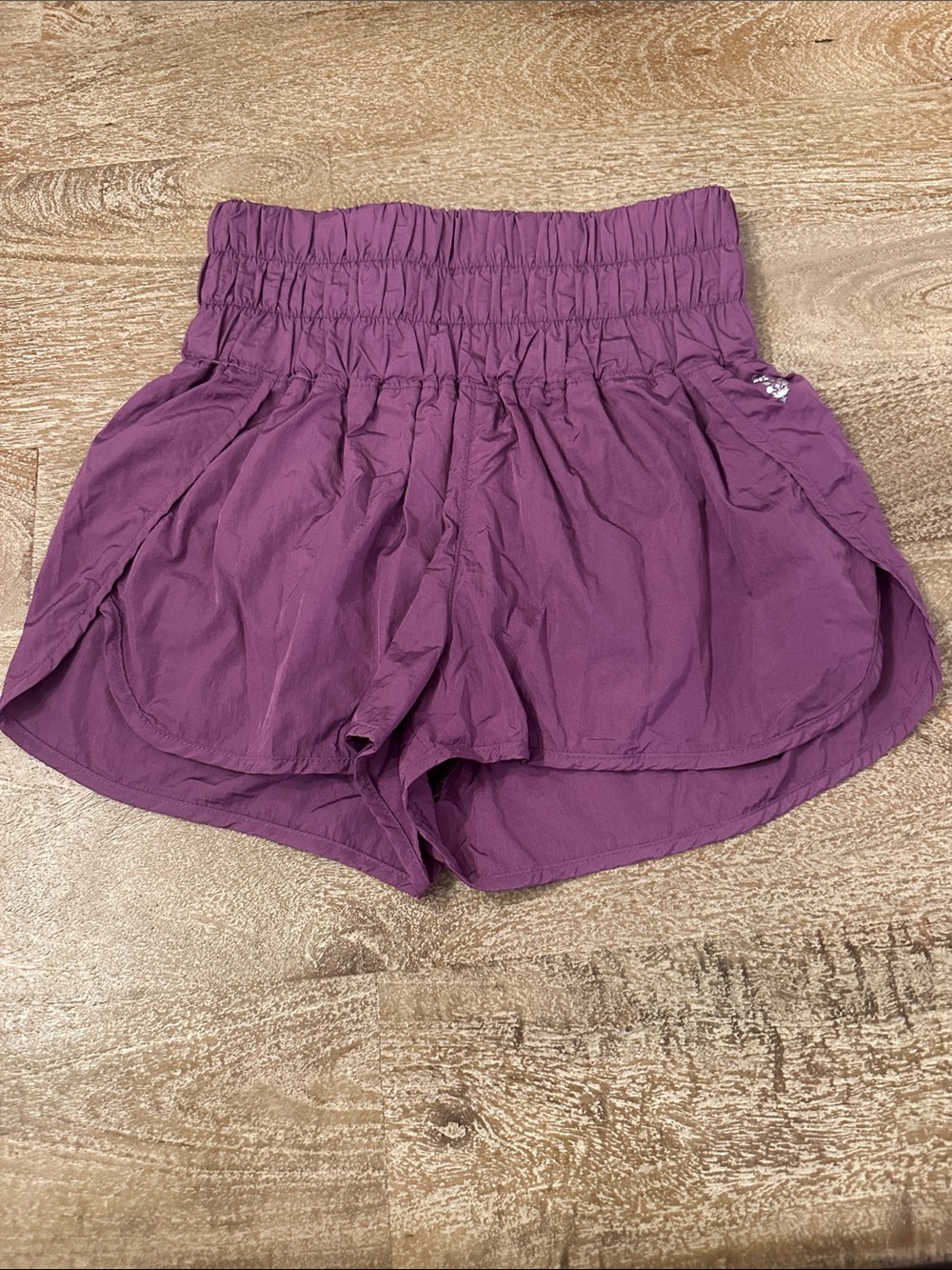 Free People High-Rise Smocked Athletic Shorts in Plum Purple